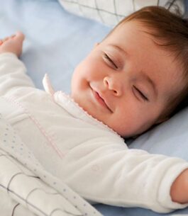 A baby who was trained with the Ferber method sleeping soundly in her crib.