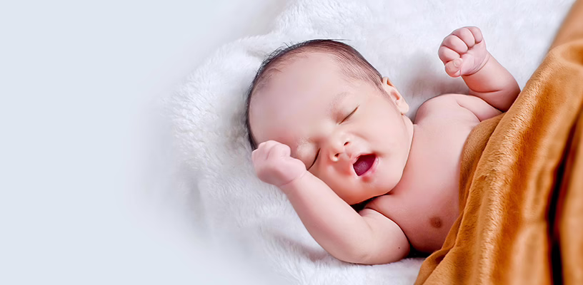 A newborn baby lying down and hiccuping.