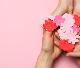 Woman in bed suffering from mild but uncomfortable ovulation symptoms.