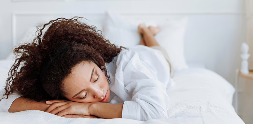 Woman sleeping in a face-down position that's wrong for pregnancy.