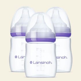 Collection of three Lansinoh Feeding Bottle units.