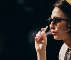 Woman smoking despite the fact that she's trying to conceive a child.