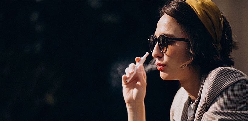 Woman smoking despite the fact that she's trying to conceive a child.