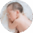 One-month-old baby sleeping on his side with his head resting on his arm.