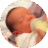 One week old baby drinking milk from baby bottle with his eyes closed.