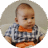 Four-month-old baby dressed in checkered shirt with bow tie.