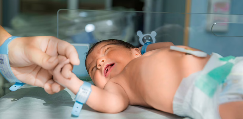 Newborn baby undergoing the Apgar test.