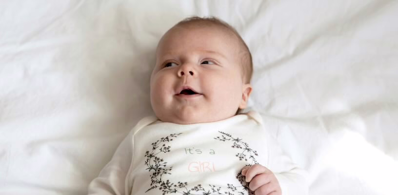 Baby with Epstein pearls lying on his back.