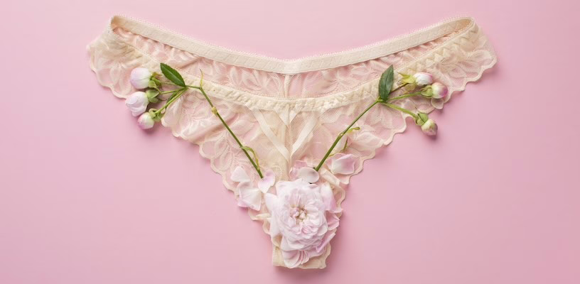 Pink-white flowers on an underwear symbolizing ovulation discharge.