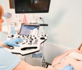 Woman receiving an ultrasound to check for vanishing twin syndrome.