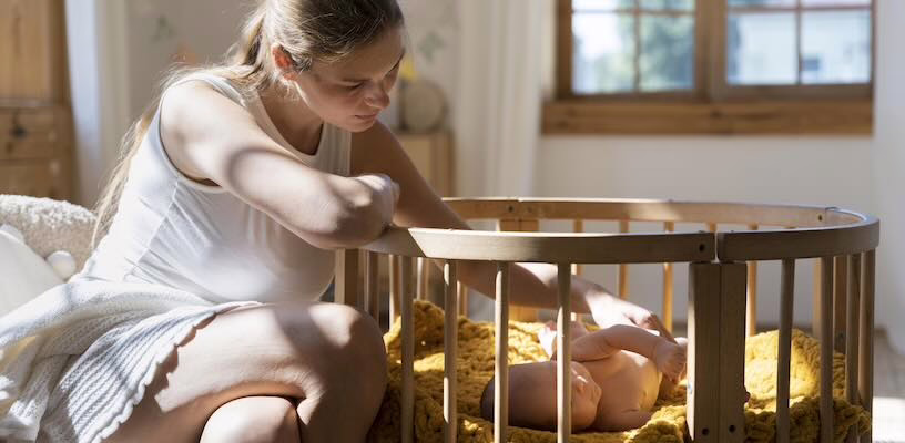 Worried mother examining the baby acne on her child's back.