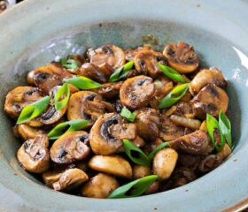 Bowl of cooked mushrooms, which would be safe for pregnant women to eat.