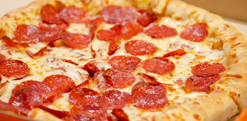 A pizza topped with pepperoni, which pregnant women can only eat if thoroughly cooked.