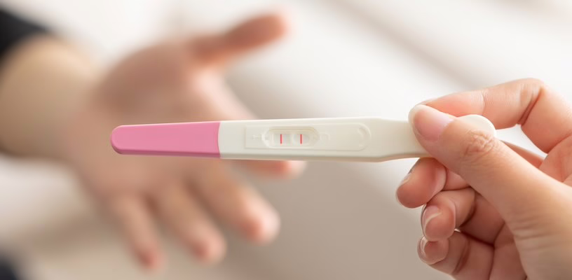 Closeup of a positive ovulation test, which increases the chances of getting pregnant.