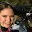 Picture of a smiling woman taking a selfie.