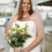 A happy bride holding a bouquet of flowers.