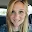 Woman with blonde hair taking a selfie.