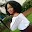 Picture of a woman looking behind her shoulders.