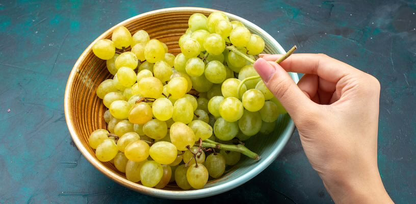 Bowl of freshly washed green grapes.