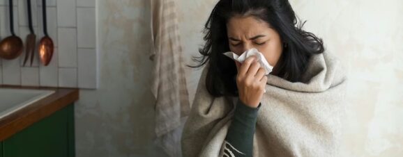 Pregnant woman sneezing after taking NyQuil.